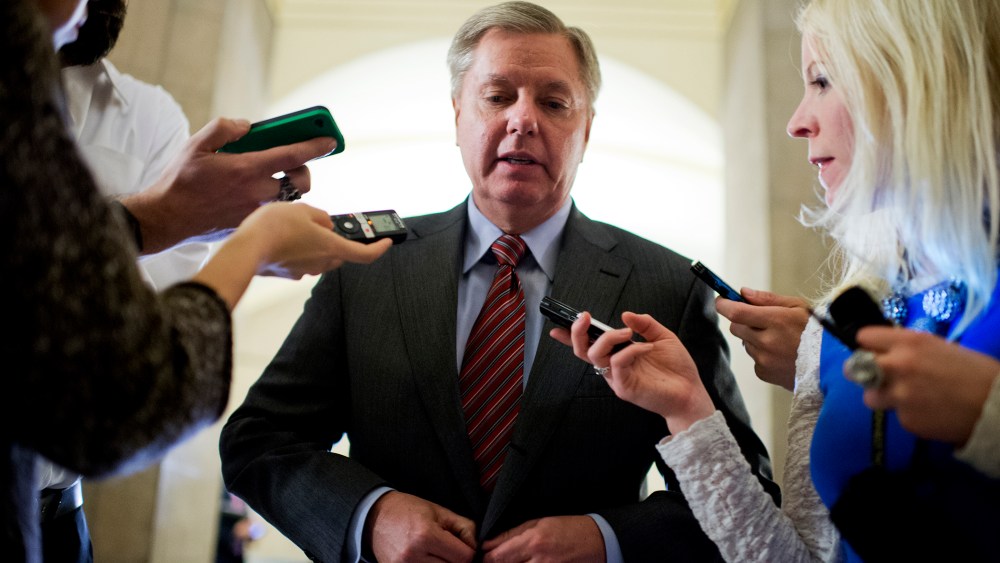 Sen. Lindsey Graham, R-S.C., talks with reporters, Jan. 28, 2014, in Washington.