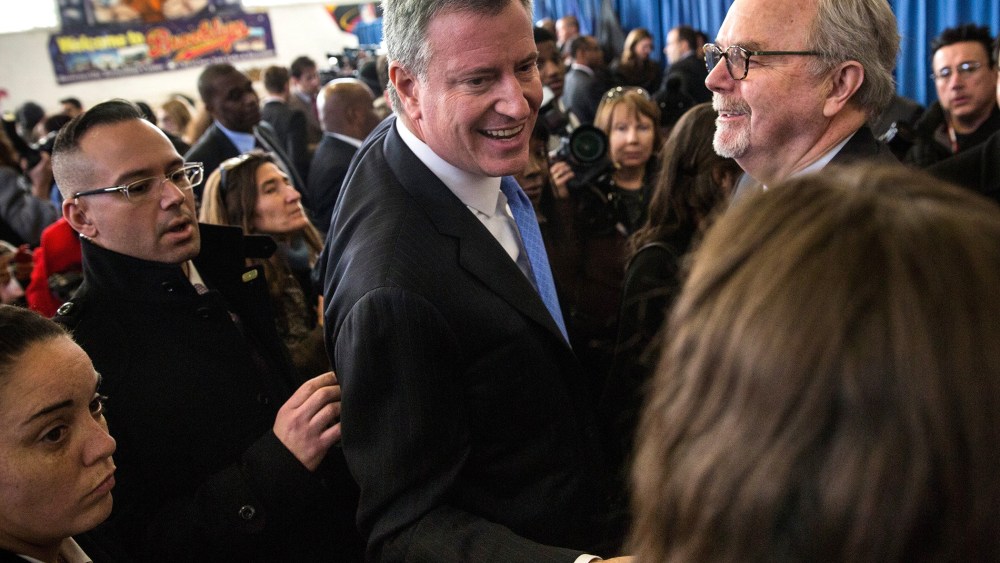 New York City Mayor Bill De Blasio (C) greets supporters after a press conference in Brownsville, Brooklyn, NY on Jan. 30, 2014.