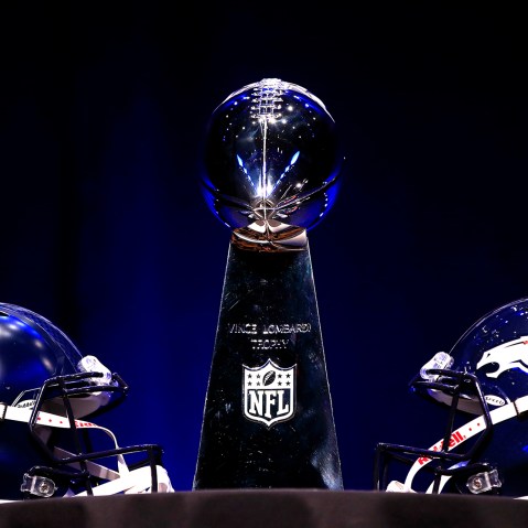 The Vince Lombardi Trophy and helmets for the Denver Broncos and the Seattle Seahawks are displayed prior to a Super Bowl XLVIII, Jan. 31, 2014, in New York, N.Y.
