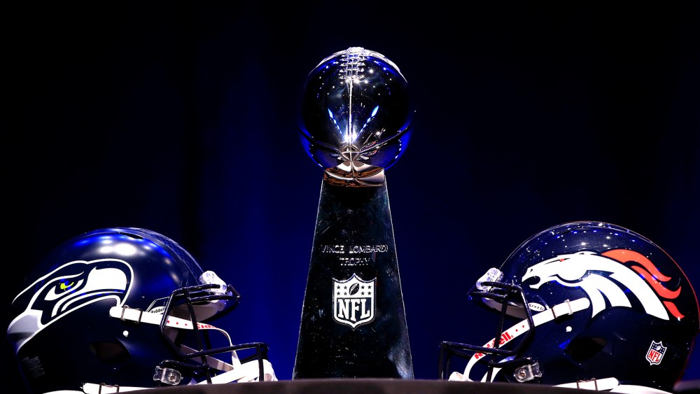 The Vince Lombardi Trophy and helmets for the Denver Broncos and the Seattle Seahawks are displayed prior to a Super Bowl XLVIII, Jan. 31, 2014, in New York, N.Y.