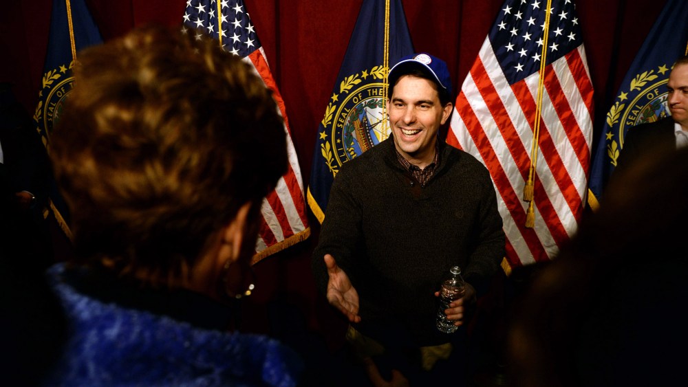 Wisconsin Governor Scott Walker shakes hands with people following a grassroots training and rally event at Concord High School March 14, 2015 in Concord, N.H. (Photo by Darren McCollester/Getty)