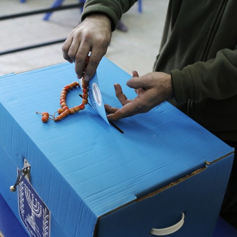 An Arab Israeli man casts his ballot at a polling station in the northern Israeli town of Umm al-Fahm on March 17, 2015. (Photo by Ahmad Gharabli/AFP/Getty)