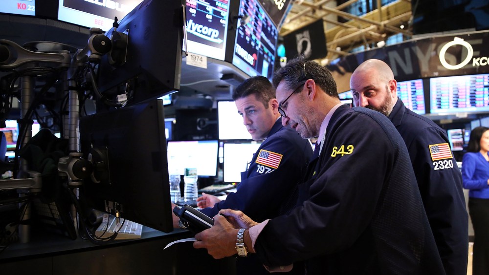 Traders work on the floor of the New York Stock Exchange at the end of the trading day, Feb. 3, 2014 in New York, N.Y.