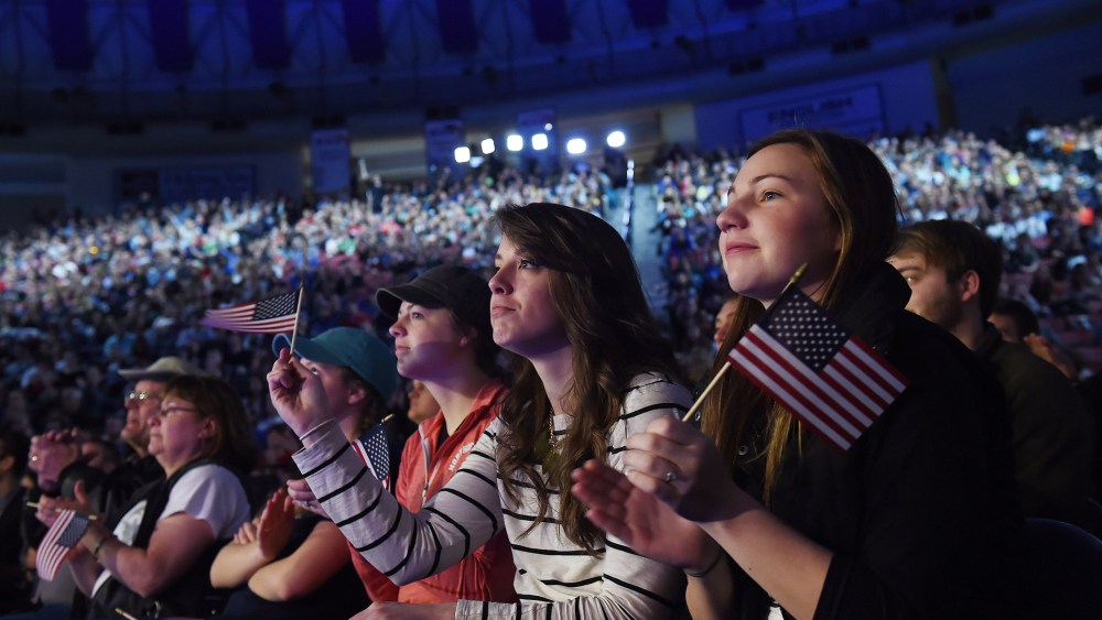 Liberty University student, Carley Bouwer, right, listens to Senator Ted Cruz (R-Texas) as he makes a speech to announce his candidacy for a presidential bid at Liberty University on March 23, 2015 in Lynchburg, Va.