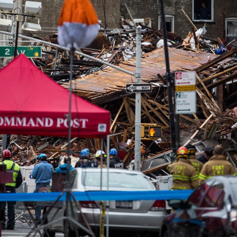 Firefighters continue to hose down the site of a seven-alarm fire that caused the collapse of two buildings and damage to two other buildings a day after the blaze took place on March 27, 2015 in New York City. (Photo by Andrew Burton/Getty)