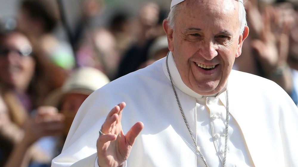 Pope Francis waves as he arrives in St. Peter's square for his general audience on April 1, 2015 in Vatican City, Vatican.