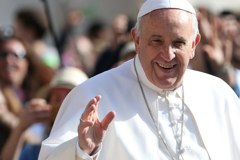Pope Francis waves as he arrives in St. Peter's square for his general audience on April 1, 2015 in Vatican City, Vatican.