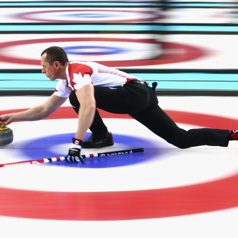 E.J. Harnden of Canada in action during a round robin curling match against Germany during day 3 of the Sochi 2014 Winter Olympics at Ice Cube Curling Center on Feb. 10, 2014 in Sochi, Russia.