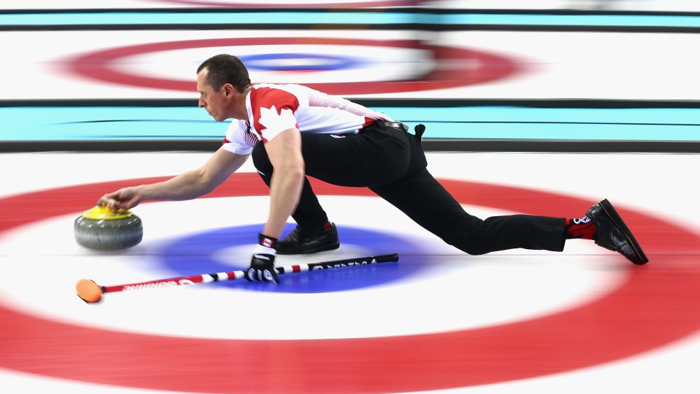 E.J. Harnden of Canada in action during a round robin curling match against Germany during day 3 of the Sochi 2014 Winter Olympics at Ice Cube Curling Center on Feb. 10, 2014 in Sochi, Russia.
