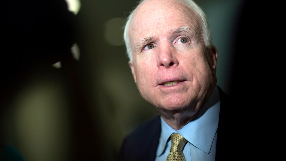 Senator John McCain (R-AZ) speaks to the media after leaving the Senate floor in Washington, D.C., U.S., on Feb. 12, 2014.
