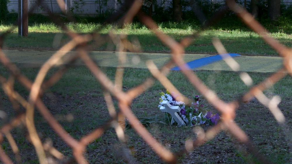 A memorial is seen through a fence marking the site where Walter Scott was killed on April 4th by a North Charleston police officer on April 10, 2015 in North Charleston, S.C.