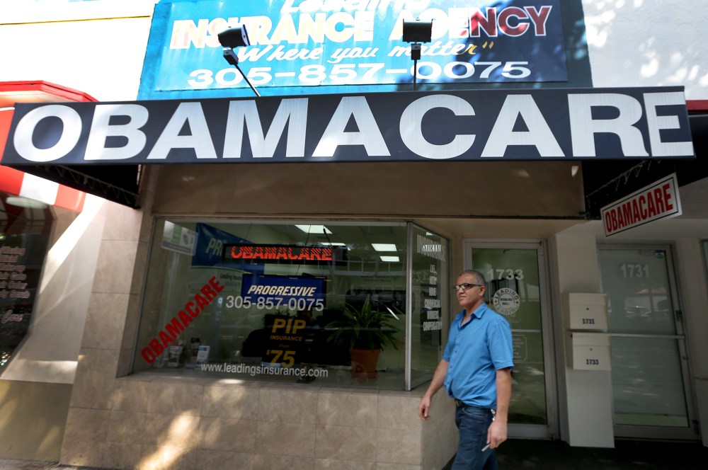Hisham Uadadeh walks out of Leading Insurance Agency after  enrolling in a health insurance plan under the Affordable Care Act on February 13, 2014 in Miami, Florida.