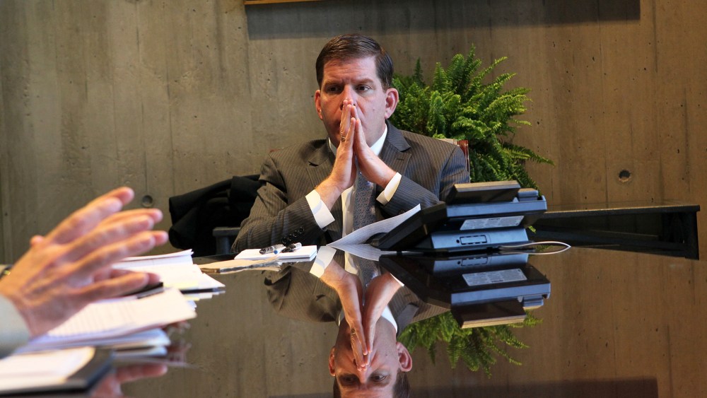 Mayor Marty Walsh listens to Paul Curran and Dave Sussick from the office of Labor Relations, during a meeting in his office, Jan. 28, 2014.