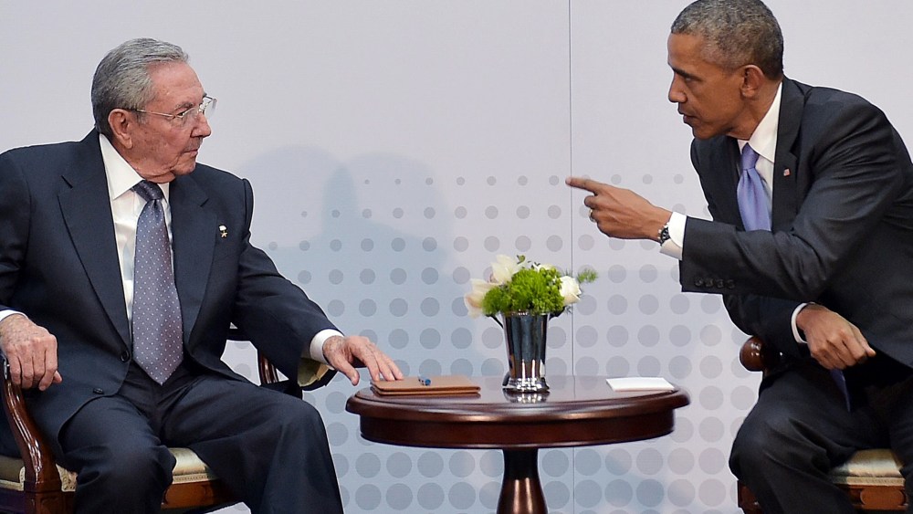 US President Barack Obama speaks with Cuba's President Raul Castro on the sidelines of the Summit of the Americas at the ATLAPA Convention center on April 11, 2015 in Panama City. (Photo by Mandel Ngan/AFP/Getty)
