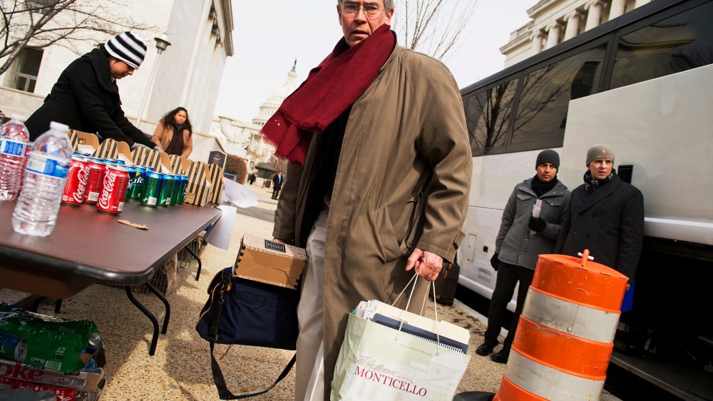 Rep. Rush Holt prepares to board a bus for the House Democrats' retreat in Cambridge, Md., Feb. 14, 2014.
