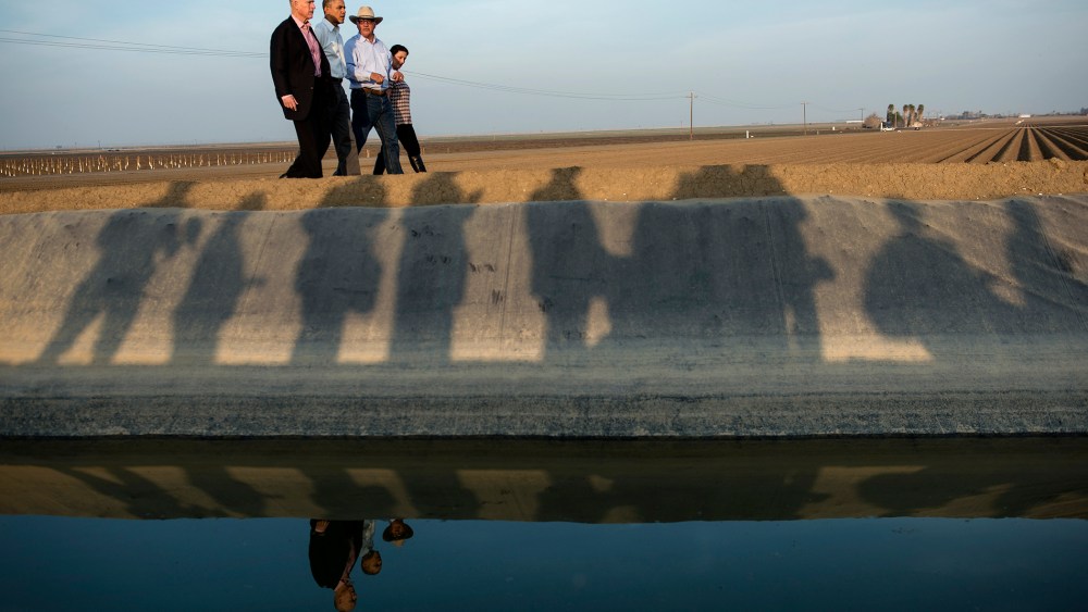 From left, California Governor Jerry Brown and President Barack Obama are lead on a tour of Empresas Del Bosque, Inc.'s farm by Joe Del Bosque and Maria Gloria Del Bosque, Feb. 14, 2014 in Los Banos, Calif.