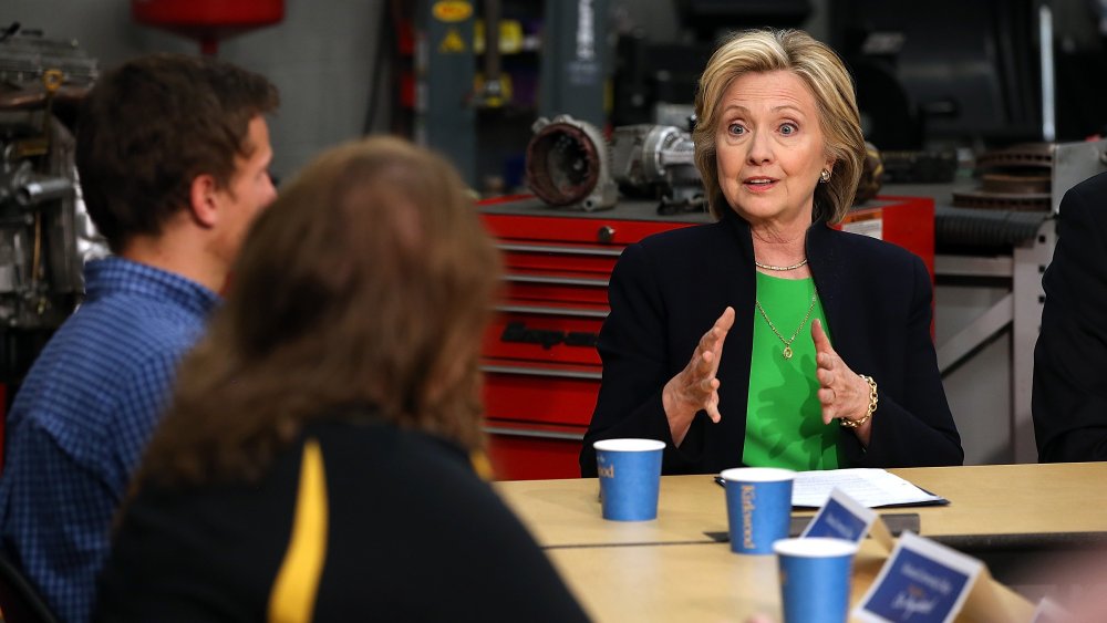 Democratic presidential hopeful and former Secretary of State Hillary Clinton (R) speaks during a roundtable discussion with students and educators on April 14, 2015 in Monticello, Iowa. (Photo by Justin Sullivan/Getty)