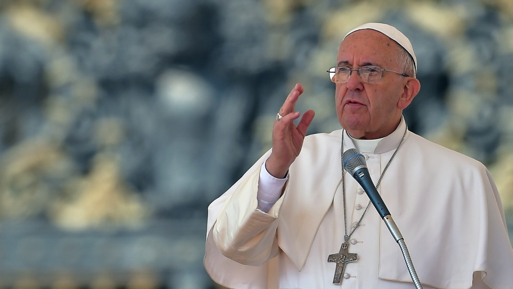 Pope Francis blesses the faithful on April 15, 2014 during his weekly general audience at the Vatican. (Photo by Vincenzo Pinto/AFP/Getty)