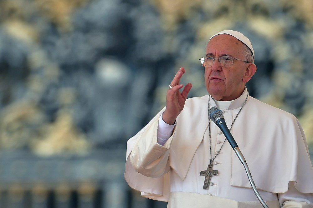 Pope Francis blesses the faithful on April 15, 2014 during his weekly general audience at the Vatican. (Photo by Vincenzo Pinto/AFP/Getty)