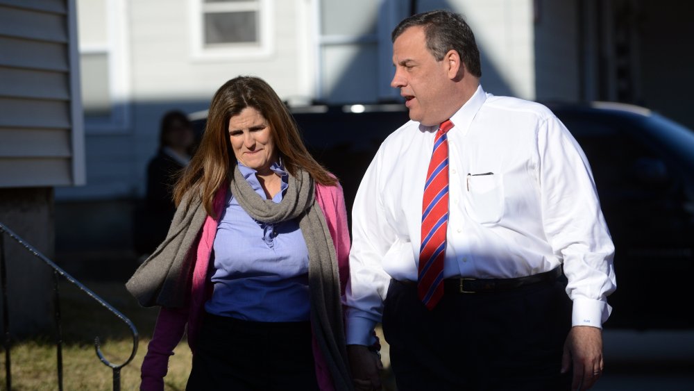 New Jersey Governor Chris Christie and wife Mary Pat Foster walk along Kelley Street to greet diners at Chez Vachon on April 15, 2015 in Manchester, N.H.