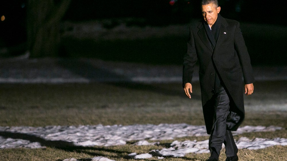 U.S. President Barack Obama walks across the South Lawn of the White House on February 17, 2014.
