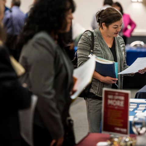 Job seekers speak with representatives at the Choice Career Fair in San Antonio, Texas, U.S., on April 16, 2015. (Photo by Matthew Busch/Bloomberg/Getty)