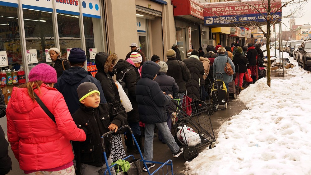 People wait in line for CAMBA's Beyond Hunger Emergency Food Pantry on February 18, 2014 in the Brooklyn borough of New York City.