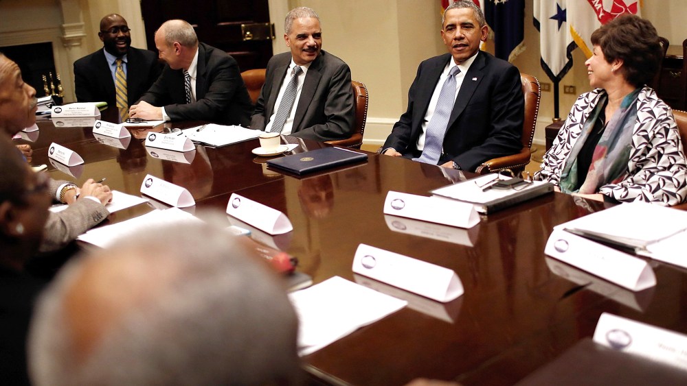 President Barack Obama (2nd R), Attorney General Eric Holder (C) and Senior Advisor to the President Valerie Jarrett (R) meet with leaders from African American civil rights groups an the White House Feb. 18, 2014 in Washington, DC.