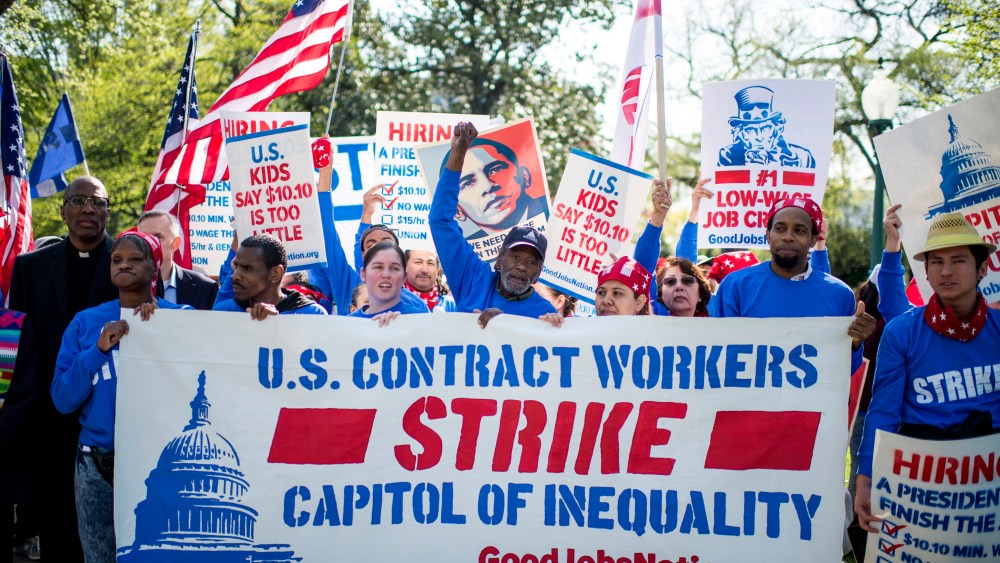 U.S. Senate contract employees along with hundreds of workers from the Capitol, Pentagon, Smithsonian Institution and others march to the Capitol to call on a living wage of at least $15 an hour, April 22, 2015. (Photo By Bill Clark/CQ Roll Call/Getty)