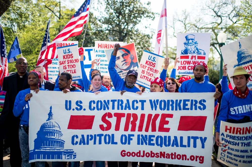U.S. Senate contract employees along with hundreds of workers from the Capitol, Pentagon, Smithsonian Institution and others march to the Capitol to call on a living wage of at least $15 an hour, April 22, 2015. (Photo By Bill Clark/CQ Roll Call/Getty)