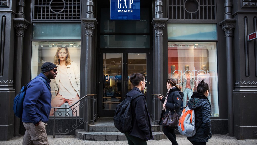 People walk past a Gap store in New York City, Feb. 20, 2014.