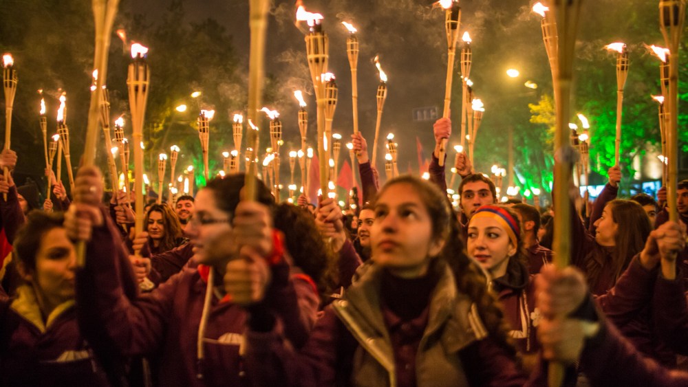 People participate in a torchlight procession through the city to commemorate the anniversary of the Armenian genocide on April 24, 2015 in Yerevan, Armenia. (Photo by Brendan Hoffman/Getty)