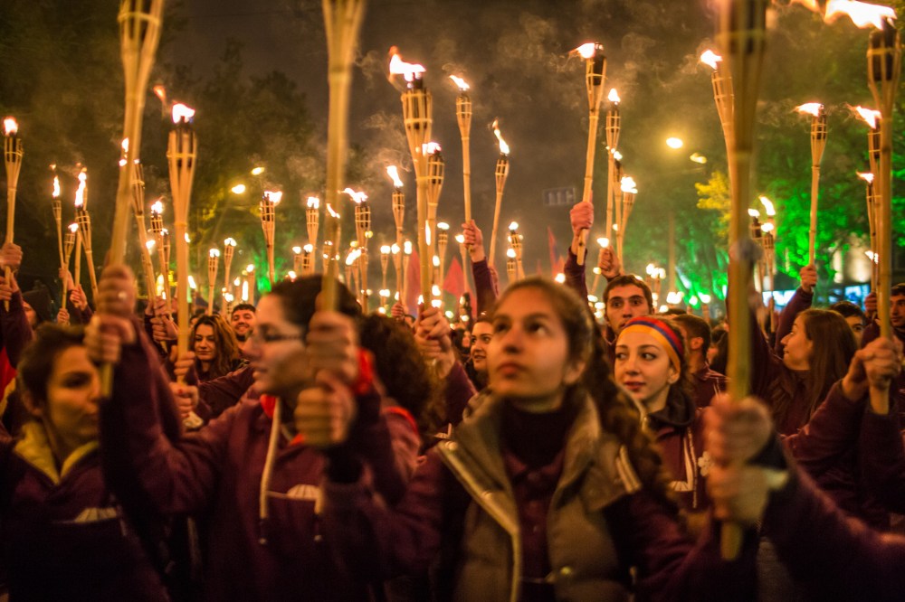 People participate in a torchlight procession through the city to commemorate the anniversary of the Armenian genocide on April 24, 2015 in Yerevan, Armenia. (Photo by Brendan Hoffman/Getty)
