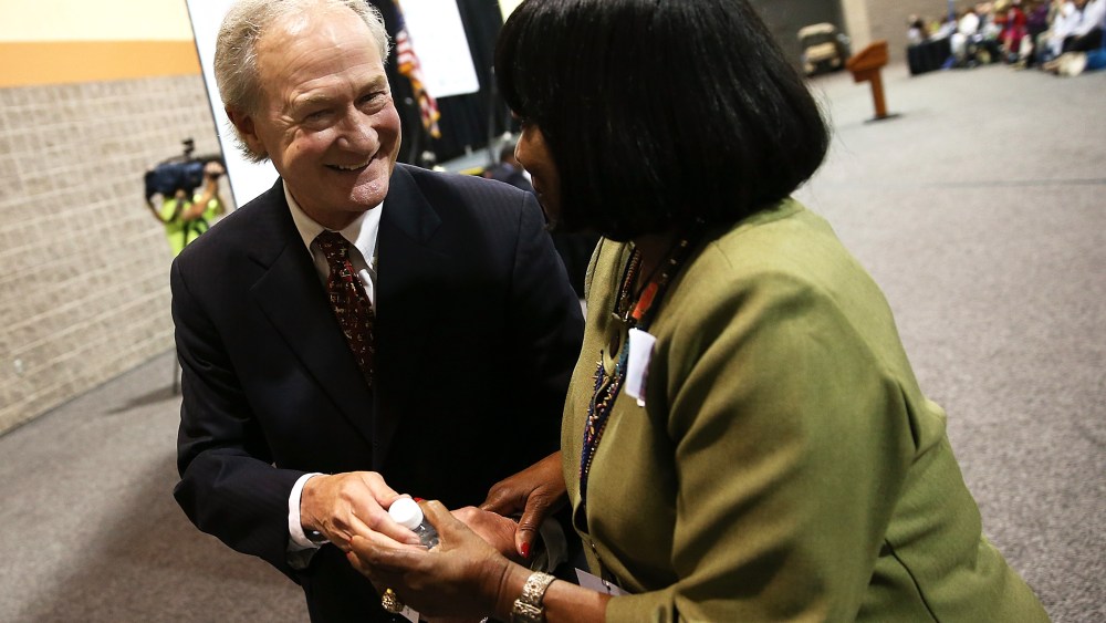 Potential Democratic presidential candidate former Sen. Lincoln Chafee (D-RI) greets a member of the audience after speaking at the South Carolina Democratic Party state convention April 25, 2015 in Columbia, S.C. (Photo by Win McNamee/Getty)