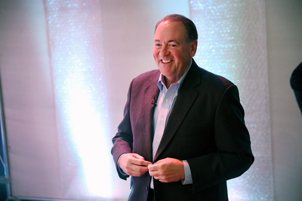 Former Arkansas Governor Mike Huckabee prepares to speak to guests gathered at the Point of Grace Church for the Iowa Faith and Freedom Coalition 2015 Spring Kickoff on April 25, 2015 in Waukee, Iowa. (Photo by Scott Olson/Getty)