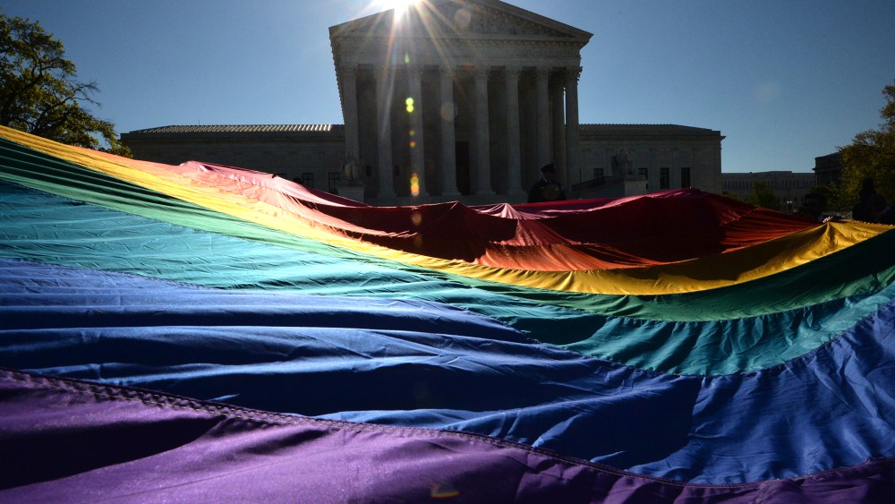 Supporters of same-sex marriages gather outside the US Supreme Court waiting for its decision on April 28, 2014 in Washington, D.C. (Photo by Mladen Antonov/AFP/Getty)