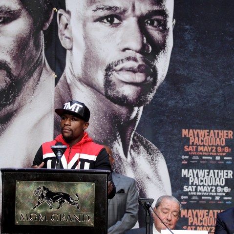 WBC/WBA welterweight champion Floyd Mayweather Jr. speaks during a news conference as WBO welterweight champion Manny Pacquiao looks on at the KA Theatre at MGM Grand Hotel & Casino, April 29, 2015 in Las Vegas, Nev. (Photo by John Gurzinski/AFP/Getty)