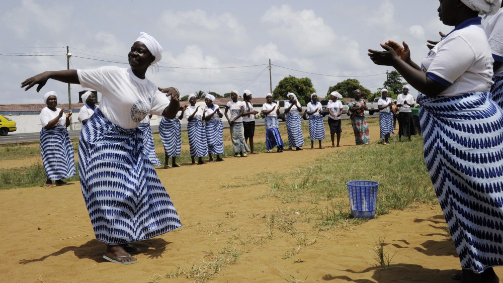 Members of the Women In Peace building Network dance and pray on May 8, 2015 in Monrovia. The World Health Organization (WHO) has declared Liberia "Ebola-free." (Photo by Zoom Dosso/AFP/Getty)