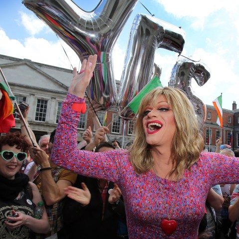 Drag queen and gay rights activist, Rory O'Neill, also known by his stage name Panti raises her arms by supporters for same-sex marriage at Dublin Castle as they wait for the result of the referendum on May 23, 2015. (Photo by Paul Faith/AFP/Getty)