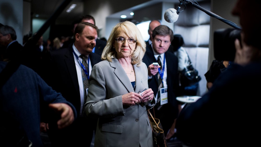 Jan Brewer walks through the National Governors Association Winter Meeting, Feb. 22, 2014.