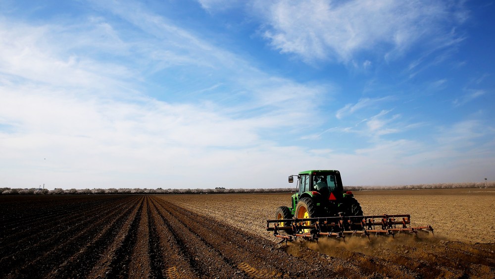 A tractor plows a field on February 25, 2014 in Firebaugh, California.