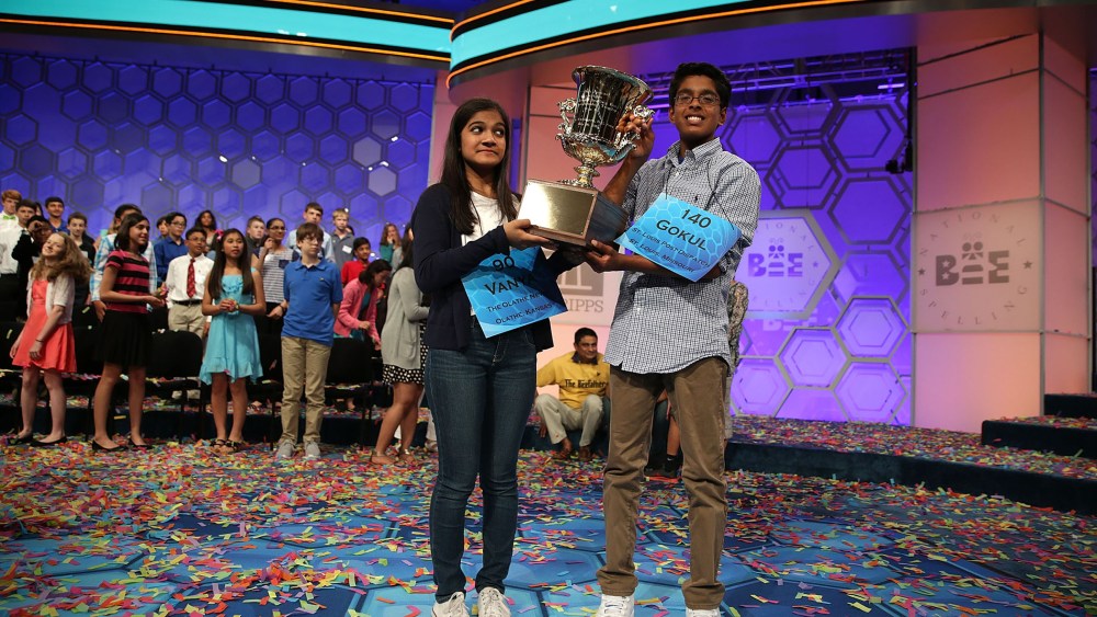 Speller Vanya Shivashankar (L) of Olathe, Kansas, and speller Gokul Venkatachalam (R) of St. Louis, Mo. hold up the trophy after winning the 2015 Scripps National Spelling Bee on May 28, 2015 in National Harbor, Md. (Photo by Alex Wong/Getty)