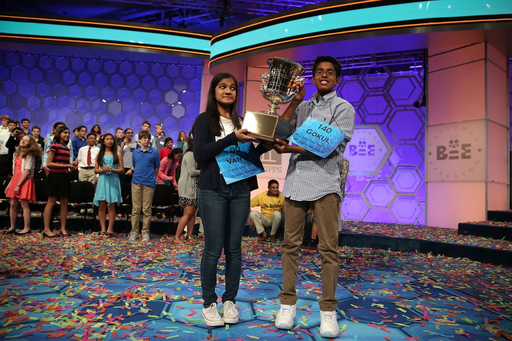 Speller Vanya Shivashankar (L) of Olathe, Kansas, and speller Gokul Venkatachalam (R) of St. Louis, Mo. hold up the trophy after winning the 2015 Scripps National Spelling Bee on May 28, 2015 in National Harbor, Md. (Photo by Alex Wong/Getty)