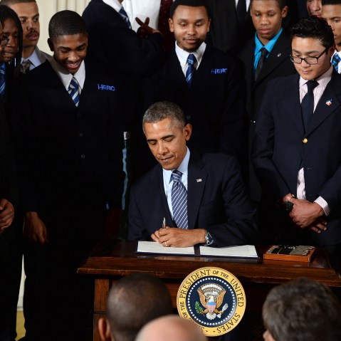 US President Barack Obama signs a presidential memorandum after speaking on his My Brothers Keeper initiative to expand opportunity for Americans in the East Room at the White House on Feb. 27, 2014 in Washington, D.C. (Photo by Jewel Samad/AFP/Getty)