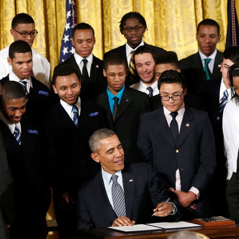 U.S. President Barack Obama signs an executive memorandum regarding the My Brother's Keeper Initiative, Feb. 27, 2014.