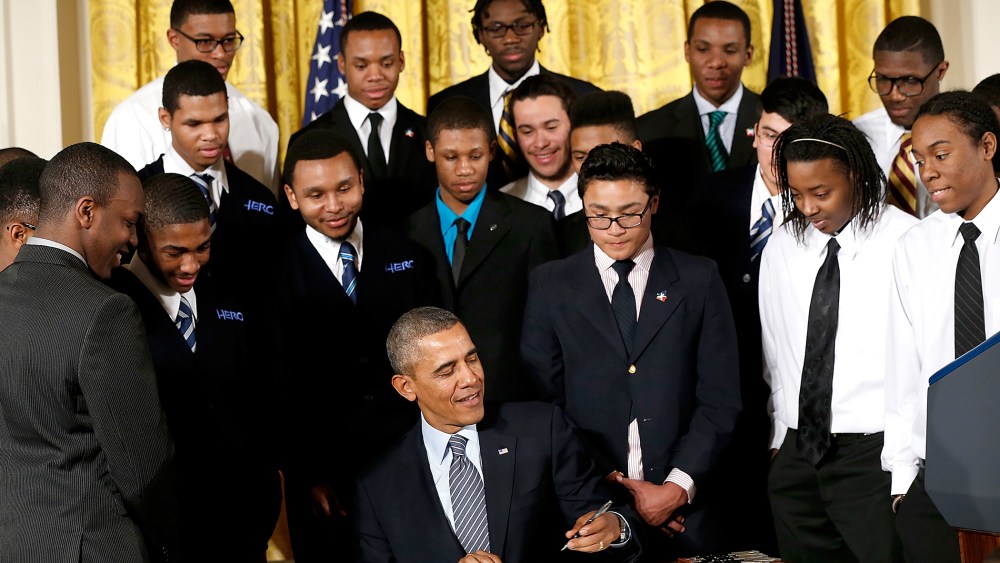 U.S. President Barack Obama signs an executive memorandum regarding the My Brother's Keeper initiative, Feb. 27, 2014.