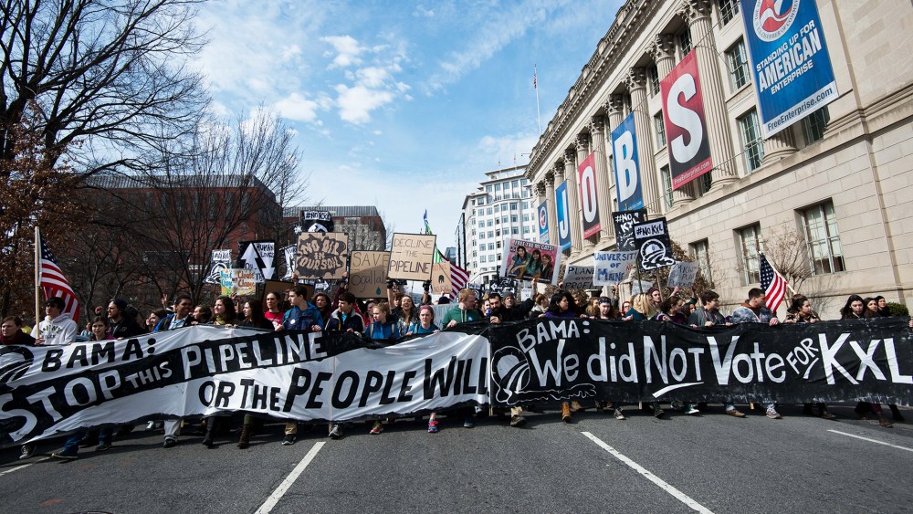 Students protesting against the proposed Keystone XL pipeline march near the White House in Washington, D.C. on March 2, 2014.