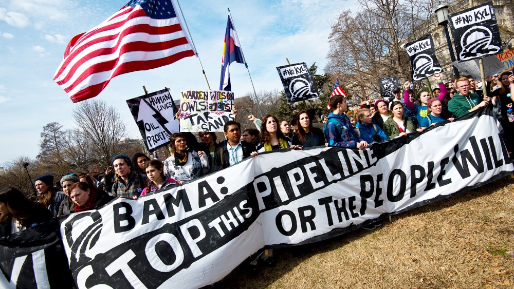 Students protest the proposed Keystone XL pipeline across from the White House, March 2, 2014.