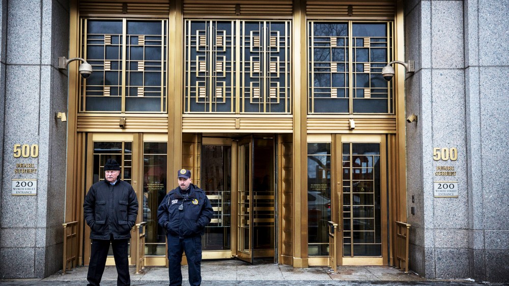 Security guards stand outside Federal Court as the trial for Osama Bin Laden's son-in-law, Sulaiman Abu Ghaith, begins in New York City, Mar. 3, 2014.