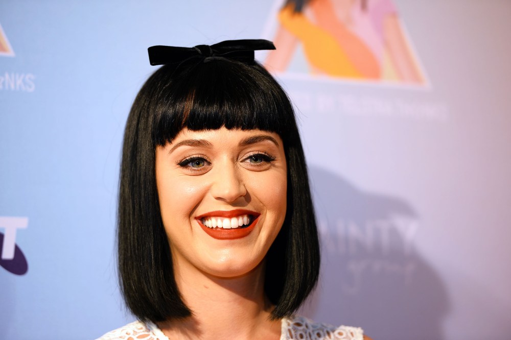 Katy Perry poses for photos at the launch of her Prismatic world tour in Sydney, March 4, 2014.